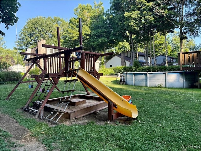 210 Townline Rd, Elma, NY 14059 - view of playground with an outdoor pool, a yard, and view of wooded area