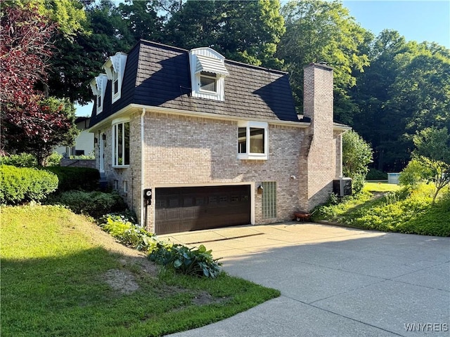 210 Townline Rd, Elma, NY 14059 - view of side of home featuring an attached garage, brick siding, a chimney, and driveway