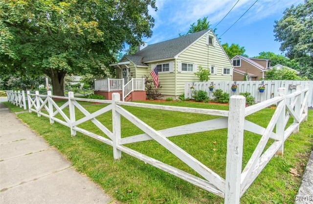 156 Barben Ave, Watertown City, NY 13601 - bungalow-style home with a fenced front yard and a shingled roof