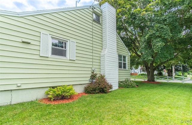 156 Barben Ave, Watertown City, NY 13601 - view of home's exterior featuring a yard and a chimney
