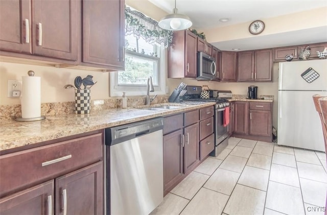 156 Barben Ave, Watertown City, NY 13601 - kitchen with appliances with stainless steel finishes, light stone counters, pendant lighting, and light tile patterned floors