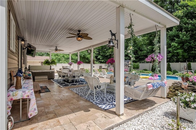 5 Family Cir, Lee, NY 13363 - fenced backyard featuring a hot tub, outdoor dining space, a patio area, and a ceiling fan