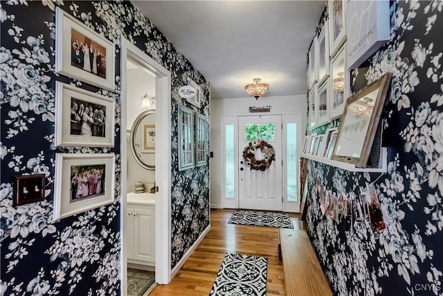 5 Family Cir, Lee, NY 13363 - entryway featuring wallpapered walls and light wood finished floors