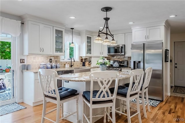 5 Family Cir, Lee, NY 13363 - kitchen featuring stainless steel appliances, white cabinets, glass insert cabinets, light wood-style flooring, and recessed lighting