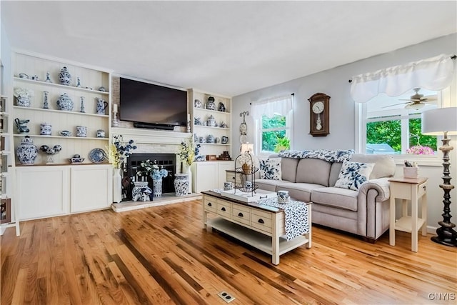 5 Family Cir, Lee, NY 13363 - living room featuring plenty of natural light, light wood-style floors, and a fireplace