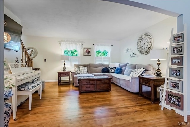 5 Family Cir, Lee, NY 13363 - living room featuring light wood-type flooring, arched walkways, and stairway