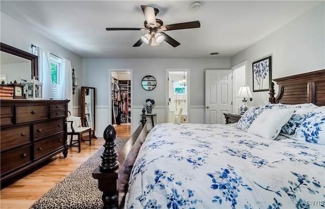 5 Family Cir, Lee, NY 13363 - bedroom featuring light wood-style floors, a walk in closet, connected bathroom, a ceiling fan, and a closet