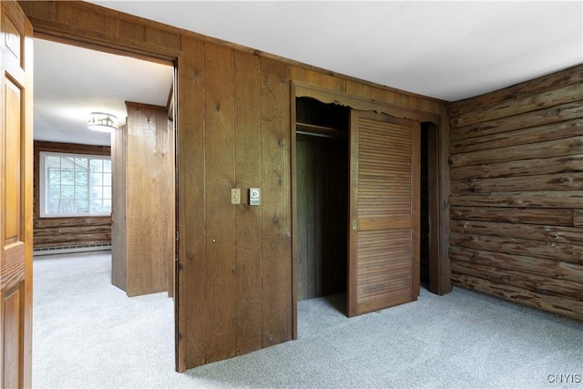 225 S Granby Rd, Granby, NY 13069 - unfurnished bedroom with carpet, a closet, wood walls, and a baseboard radiator
