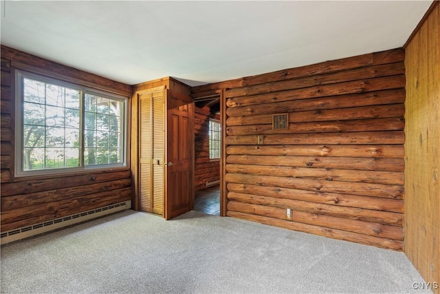 225 S Granby Rd, Granby, NY 13069 - unfurnished bedroom with rustic walls, a baseboard radiator, and carpet