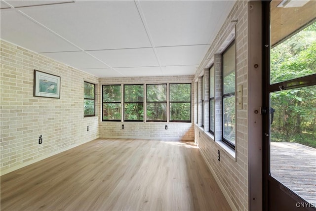 225 S Granby Rd, Granby, NY 13069 - unfurnished sunroom with brick wall and wood finished floors