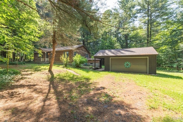 225 S Granby Rd, Granby, NY 13069 - view of grassy yard with driveway, an outbuilding, and a detached garage