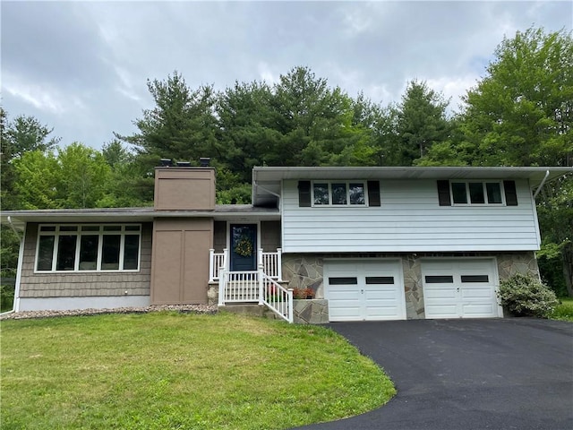 2115 Hornby Rd, Orange, NY 14812 - split level home featuring a chimney, an attached garage, driveway, and a front lawn