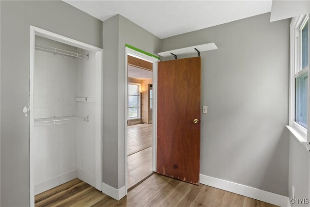 2129 Berry Rd, Lafayette, NY 13084 - unfurnished bedroom with a closet and wood finished floors