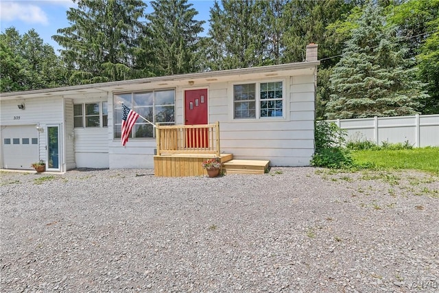 2129 Berry Rd, Lafayette, NY 13084 - view of front of property with a chimney, a garage, and driveway