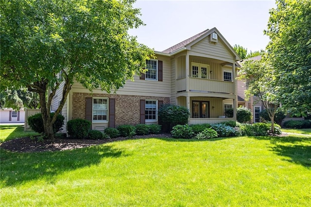 42 Wood Creek Dr, Pittsford, NY 14534 - view of front facade featuring a front lawn, brick siding, and board and batten siding