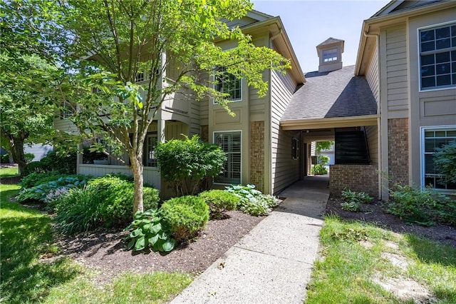 42 Wood Creek Dr, Pittsford, NY 14534 - view of front of house featuring brick siding and a shingled roof