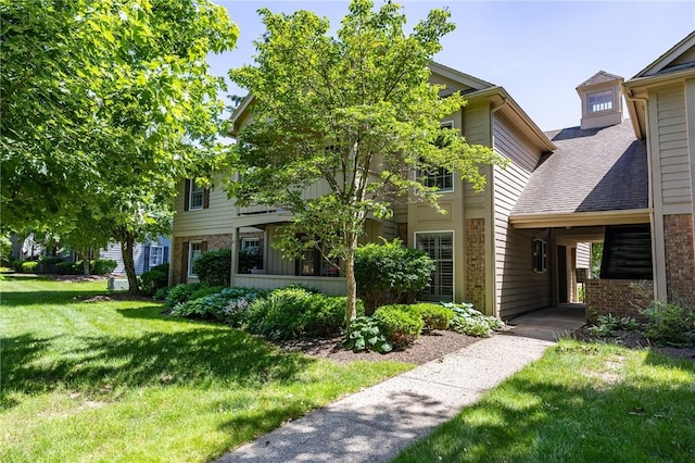 42 Wood Creek Dr, Pittsford, NY 14534 - view of front facade with a front yard, brick siding, and a shingled roof