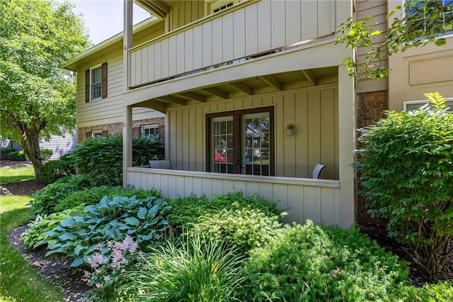 42 Wood Creek Dr, Pittsford, NY 14534 - view of exterior entry with board and batten siding