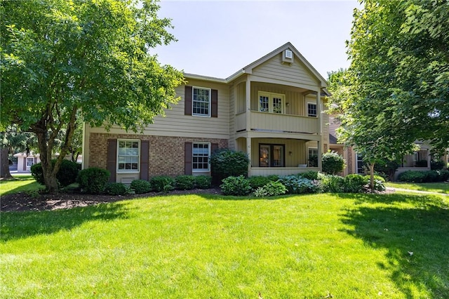 42 Wood Creek Dr, Pittsford, NY 14534 - view of front of house featuring a front lawn, brick siding, and board and batten siding