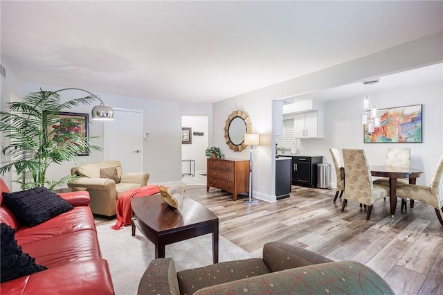 42 Wood Creek Dr, Pittsford, NY 14534 - living room featuring light wood finished floors and baseboards