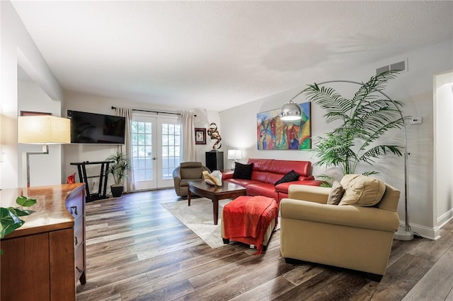 42 Wood Creek Dr, Pittsford, NY 14534 - living room with wood finished floors and french doors