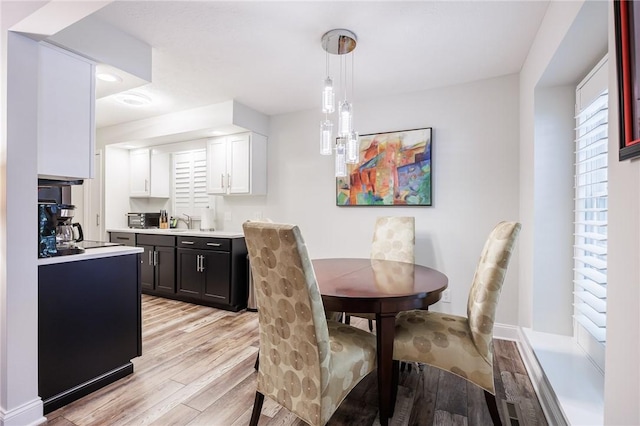 42 Wood Creek Dr, Pittsford, NY 14534 - dining room featuring light wood-style flooring and baseboards