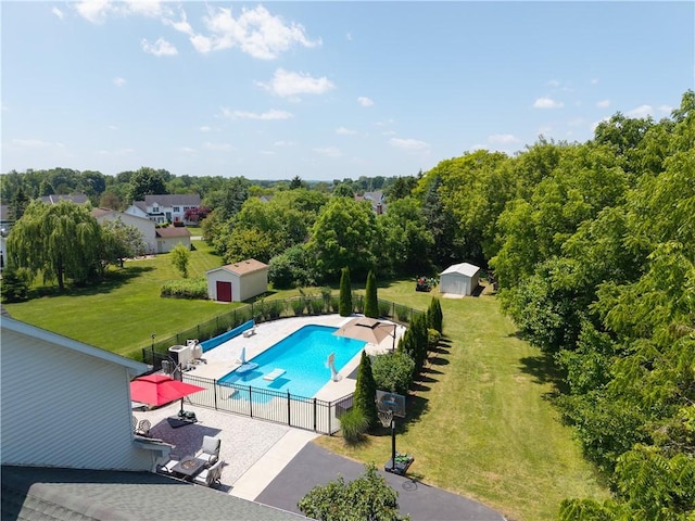 255 Watson Rd, Perinton, NY 14450 - view of swimming pool with a patio area and a storage shed
