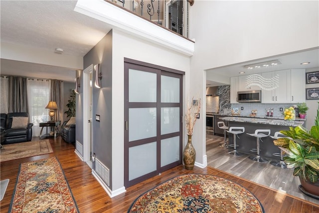 255 Watson Rd, Perinton, NY 14450 - foyer with wood finished floors