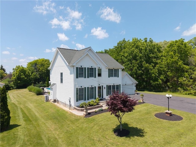 255 Watson Rd, Perinton, NY 14450 - colonial inspired home featuring a front yard and asphalt driveway
