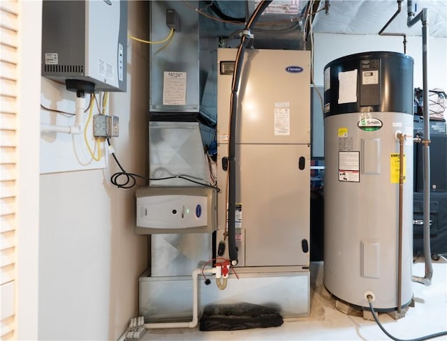 255 Watson Rd, Perinton, NY 14450 - utility room with hybrid water heater, water heater, and heating unit
