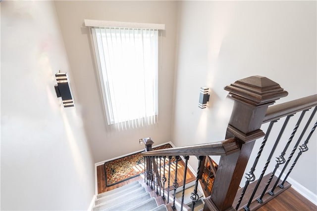 255 Watson Rd, Perinton, NY 14450 - stairway featuring baseboards and wood finished floors