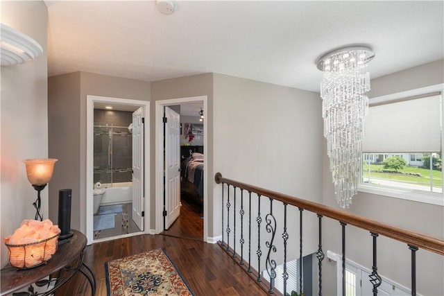 255 Watson Rd, Perinton, NY 14450 - hall featuring a chandelier and wood finished floors