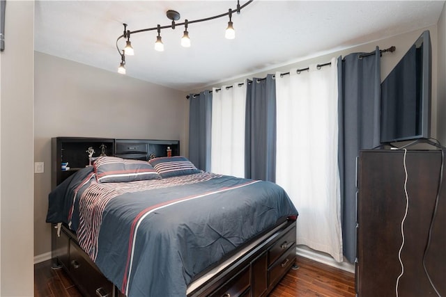 255 Watson Rd, Perinton, NY 14450 - bedroom with dark wood-type flooring and rail lighting