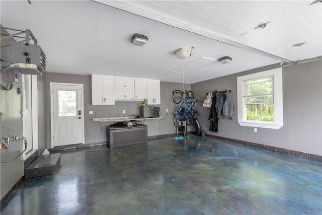 255 Watson Rd, Perinton, NY 14450 - garage with baseboards and a garage door opener