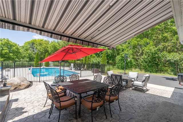 255 Watson Rd, Perinton, NY 14450 - view of patio with outdoor dining space and view of wooded area