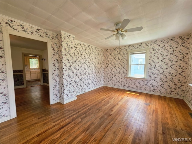 942 N 4th St, Olean, NY 14760 - unfurnished room featuring wood-type flooring, wallpapered walls, ceiling fan, and ornamental molding