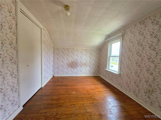 942 N 4th St, Olean, NY 14760 - bonus room featuring hardwood / wood-style floors, wallpapered walls, and vaulted ceiling