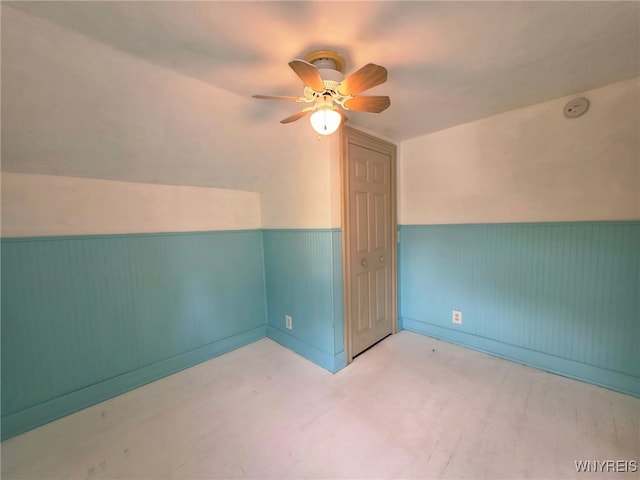 942 N 4th St, Olean, NY 14760 - additional living space with vaulted ceiling, a ceiling fan, and a wainscoted wall