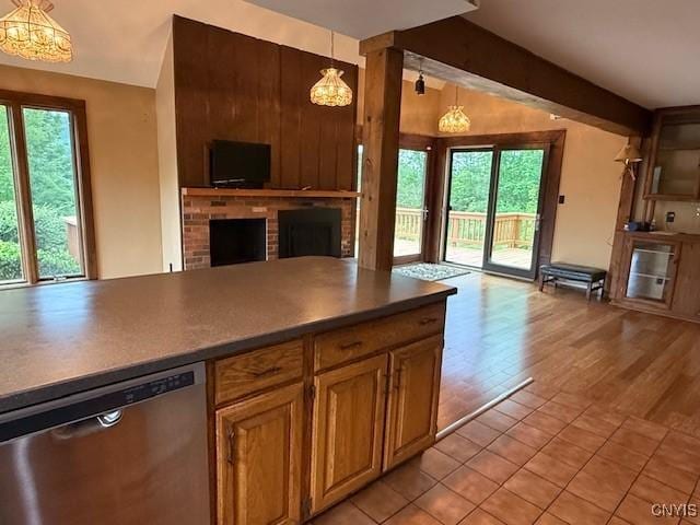 2033 Artemis Dr, Virgil, NY 13045 - kitchen featuring dishwasher, open floor plan, a brick fireplace, pendant lighting, and vaulted ceiling