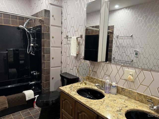 2033 Artemis Dr, Virgil, NY 13045 - bathroom featuring shower / bath combination, double vanity, tile walls, backsplash, and tile patterned flooring