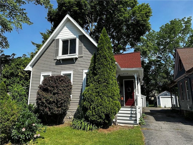 18 Weider St, Rochester, NY 14620 - view of front of house featuring an outbuilding and a garage