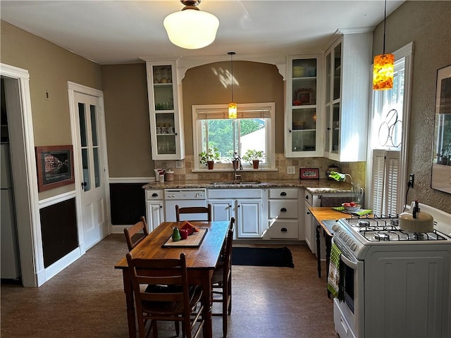 18 Weider St, Rochester, NY 14620 - kitchen featuring white appliances, decorative light fixtures, glass insert cabinets, backsplash, and white cabinetry