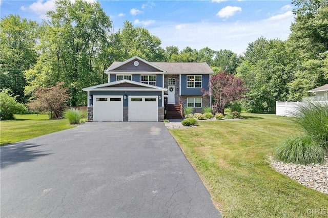 9545 Horseshoe Island Rd, Clay, NY 13041 - bi-level home featuring driveway, a front lawn, stone siding, and an attached garage
