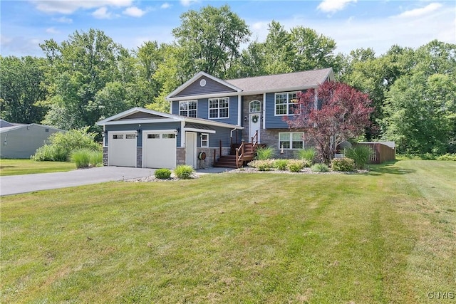 9545 Horseshoe Island Rd, Clay, NY 13041 - raised ranch featuring stone siding, driveway, a front yard, and an attached garage