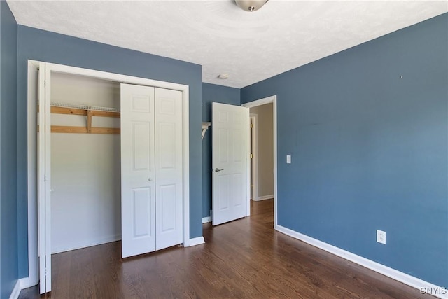 9545 Horseshoe Island Rd, Clay, NY 13041 - unfurnished bedroom featuring a closet and wood finished floors
