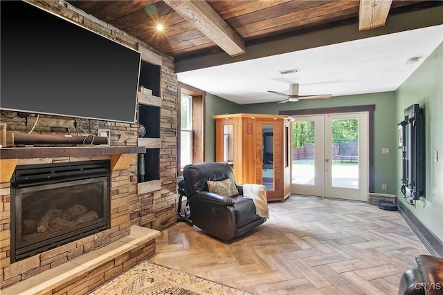 9545 Horseshoe Island Rd, Clay, NY 13041 - living room featuring a stone fireplace, french doors, a wooden ceiling with exposed beams, and ceiling fan