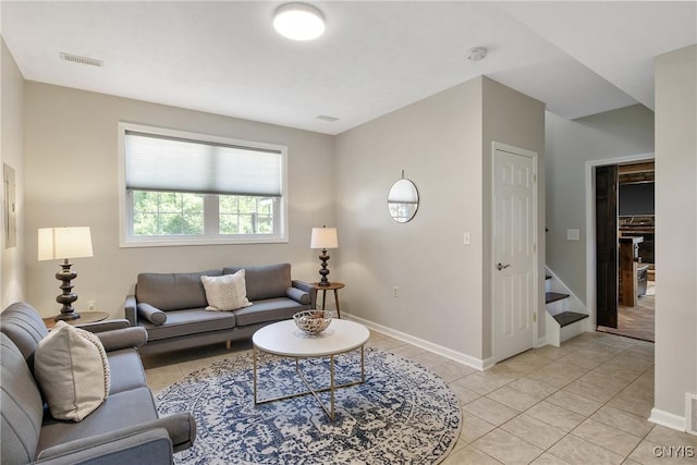 9545 Horseshoe Island Rd, Clay, NY 13041 - living area with light tile patterned flooring and stairs