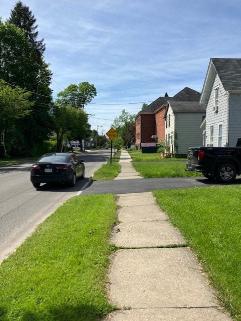 81 Silver St, Norwich, NY 13815 - view of asphalt road featuring sidewalks and traffic signs