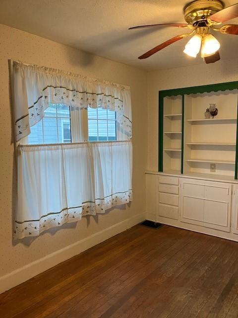 81 Silver St, Norwich, NY 13815 - unfurnished dining area featuring dark wood finished floors and ceiling fan