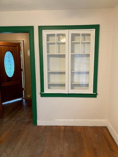 81 Silver St, Norwich, NY 13815 - unfurnished dining area with baseboards and dark wood finished floors